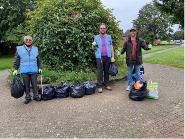 Conservative Action Team Members Hareshkumar Bhalsod and Peter Edwards joined residents (including James) to clean up Bedfont
